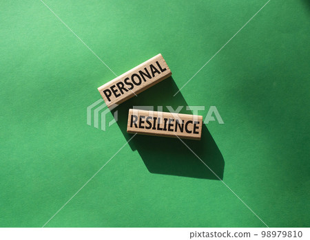 Personal resilience symbol. Wooden blocks with words Personal resilience. Beautiful green background. Business and Personal resilience concept. Copy space. 98979810