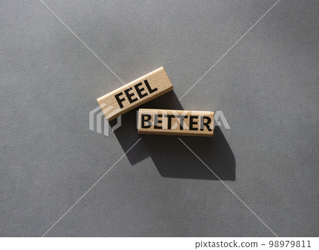 Feel better symbol. Wooden blocks with words Feel better. Beautiful grey background. Business and Feel better concept. Copy space. 98979811