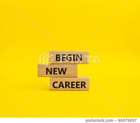 Begin new career symbol. Concept word Begin new career on wooden blocks. Beautiful yellow background. Business and Begin new career concept. Copy space 98979897