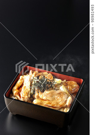 Hot charcoal-grilled yakitori with plenty of sauce, photographed against a black background Hot charcoal-grilled yakitori with plenty of sauce, photographed against a black background 98981493