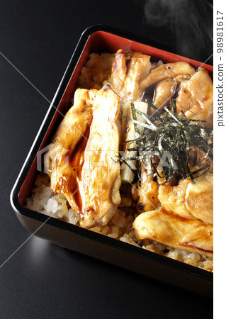 Overhead shot of hot charcoal-grilled yakitori with plenty of sauce on a black background 98981617