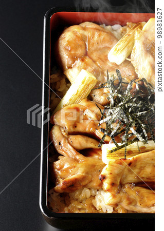 Overhead shot of hot charcoal-grilled yakitori with plenty of sauce on a black background Overhead shot of hot charcoal-grilled yakitori with plenty of sauce on a black background 98981627