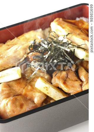 Hot charcoal-grilled yakitori with plenty of sauce, photographed against a white background Hot charcoal-grilled yakitori with plenty of sauce, photographed against a white background 98981699