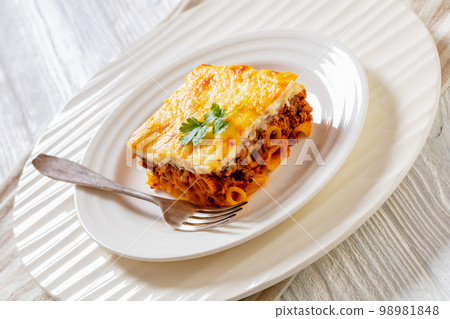 Greek Pastitsio on white plate, top view Greek Pastitsio on white plate, top view 98981848