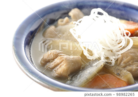 Hot pork offal stew with carrots, konjac, burdock and radish shot against a white background Hot pork offal stew with carrots, konjac, burdock and radish shot against a white background 98982265