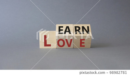 Learn and Love symbol. Turned wooden cubes with words Love and Learn. Beautiful grey background. Lifestyle and Learn and Love concept. Copy space. 98982781
