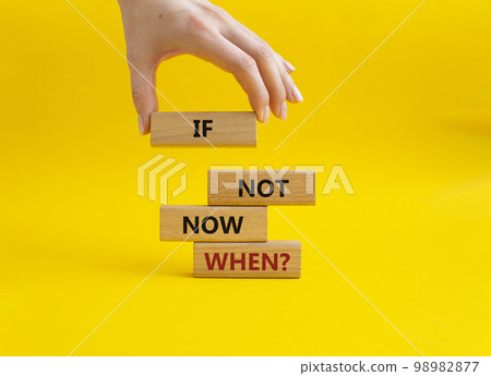 If not now when symbol. Concept words If not now when on wooden blocks. Beautiful yellow background. Businessman hand. Business and If not now when concept. Copy space. If not now when symbol. Concept words If not now when on wooden blocks. Beautiful yellow background. Businessman hand. Business and If not now when concept. Copy space. 98982877