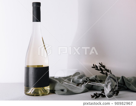 Bottle of white wine with glass 98982967
