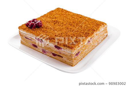 honey cake on plate isolated on white honey cake on plate isolated on white 98983002