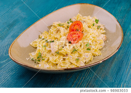 tasty farfalle pasta with parmesan cheese 98983033