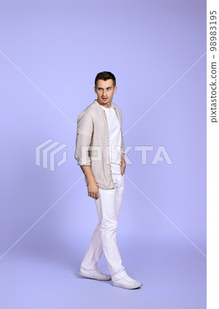 happy man walks isolated on violet background. happy man walks isolated on violet background. 98983195