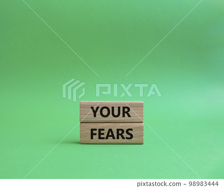 Your fears symbol. Wooden blocks with words Your fears. Beautiful green background. Business and Your fears concept. Copy space. Your fears symbol. Wooden blocks with words Your fears. Beautiful green background. Business and Your fears concept. Copy space. 98983444