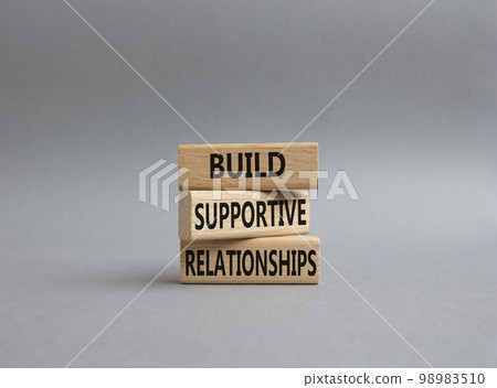 Build Supportive Ralationships symbol. Wooden blocks with words Build Supportive Ralationships. Beautiful grey background. Business and Build Supportive Ralationships. Copy space. Build Supportive Ralationships symbol. Wooden blocks with words Build Supportive Ralationships. Beautiful grey background. Business and Build Supportive Ralationships. Copy space. 98983510