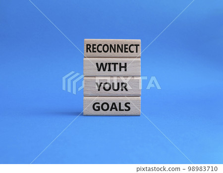 Goals symbol. Wooden blocks with words 'Reconnect with your goals'. Beautiful blue background. Business and 'Reconnect with your goals' concept. Copy space. 98983710