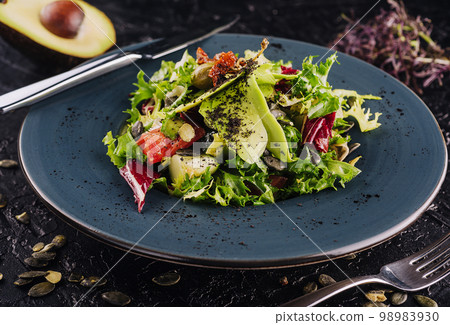 fresh salad with avocado, lettuce, microgreen, cabbage, cucumber fresh salad with avocado, lettuce, microgreen, cabbage, cucumber 98983930