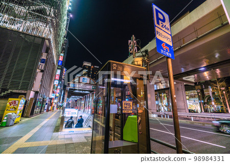 Tokyo cityscape in Japan Roppongi at night. Public telephone, free Wi-Fi, Roppongi station entrance 4b in the back Tokyo cityscape in Japan Roppongi at night. Public telephone, free Wi-Fi, Roppongi station entrance 4b in the back 98984331