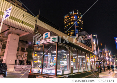 Tokyo cityscape in Japan Roppongi at night. Roppongi Station entrance 4b and Roppongi Hills in the back Tokyo cityscape in Japan Roppongi at night. Roppongi Station entrance 4b and Roppongi Hills in the back 98984424