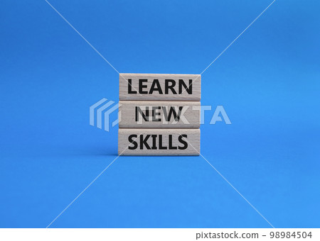 Learn new skills symbol. Concept words 'Learn new skills' on wooden blocks. Beautiful blue background. Business and Learn new skills concept. Copy space. Learn new skills symbol. Concept words 'Learn new skills' on wooden blocks. Beautiful blue background. Business and Learn new skills concept. Copy space. 98984504