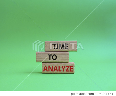 Time to Analyze symbol. Concept word Time to Analyze on wooden blocks. Beautiful green background. Business and Time to Analyze concept. Copy space 98984574