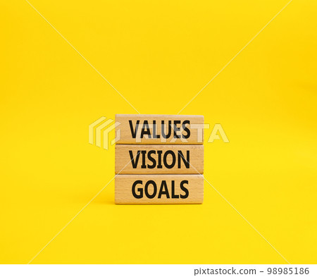 Values Vision Goals symbol. Concept words Values Vision Goals on wooden blocks. Beautiful yellow background. Business and Values Vision Goals concept. Copy space. Values Vision Goals symbol. Concept words Values Vision Goals on wooden blocks. Beautiful yellow background. Business and Values Vision Goals concept. Copy space. 98985186