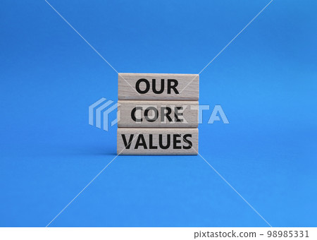 Our core values symbol. Concept words 'Our core values' on wooden blocks. Beautiful blue background. Business and Our core values concept. Copy space. 98985331