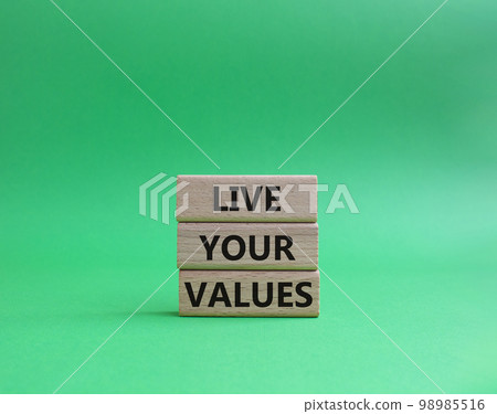 Live your values symbol. Concept words 'Live your values' on wooden blocks. Beautiful green background. Business and Live your values concept. Copy space. 98985516