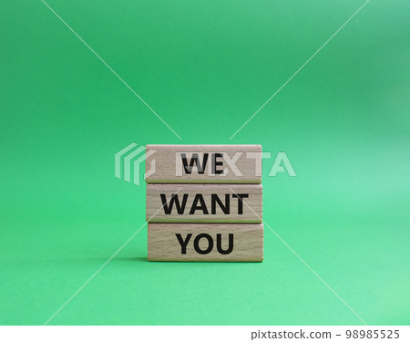 We want you symbol. Concept words We want you on wooden blocks. Beautiful green background. Business and We want you concept. Copy space. 98985525