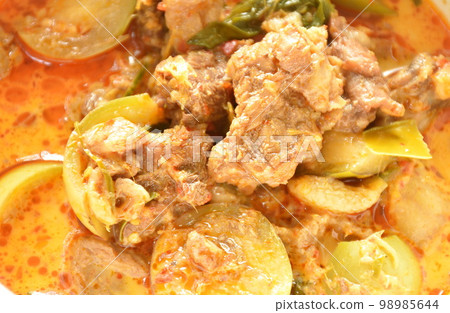 spicy boiled beef meat with eggplant in coconut milk green curry soup on bowl  98985644