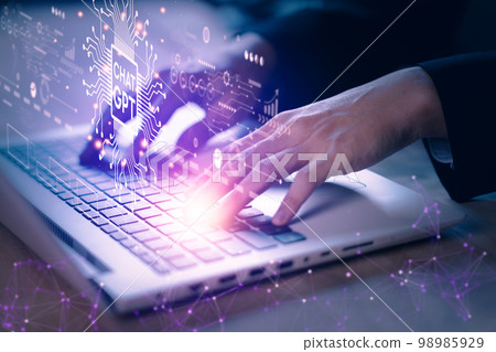ChatGPT chatting with artificial intelligence or AI. Businessman using notebook (laptop) with chatbot by OpenAI. Futuristic technology concept. ChatGPT chatting with artificial intelligence or AI. Businessman using notebook (laptop) with chatbot by OpenAI. Futuristic technology concept. 98985929