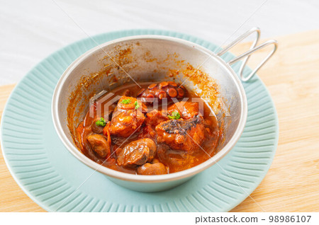 Boiled octopus with tomato sauce made in Sierra cup Boiled octopus with tomato sauce made in Sierra cup 98986107
