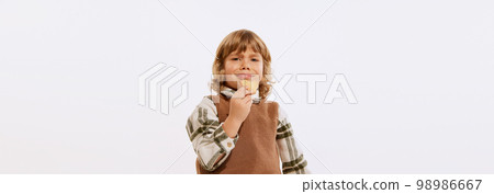 Studio shot of little boy, preschool age kid wearing retro style clothes isolated over white background. Concept of emotions, 50s, 60s vintage fashion style, childhood Studio shot of little boy, preschool age kid wearing retro style clothes isolated over white background. Concept of emotions, 50s, 60s vintage fashion style, childhood 98986667