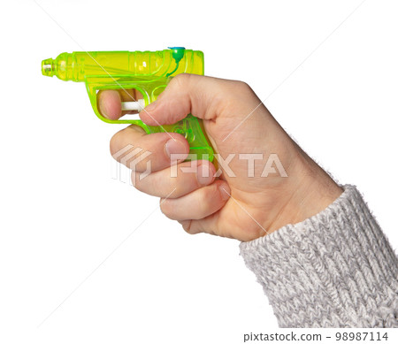 Hand holding plastic watergun toy 98987114