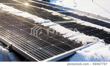 Snow melts on solar panels with the arrival of spring Snow melts on solar panels with the arrival of spring 98987787