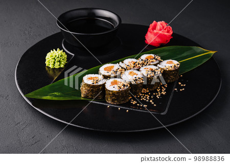 Sushi Rolls Set with Salmon on black plate Sushi Rolls Set with Salmon on black plate 98988836