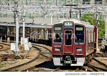 Hankyu Railway Series 9000 train running near Umeda Station in Osaka Hankyu Railway Series 9000 train running near Umeda Station in Osaka 98989749