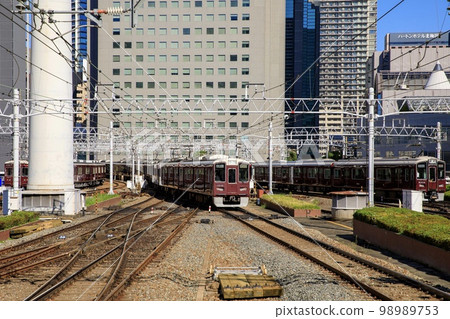 Hankyu Railway Series 1000 train running near Umeda Station in Osaka 98989753