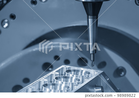 Close up scene the 5-axis machining center cutting the V8 engine cylinder block with solid ball end mill tool. 98989822