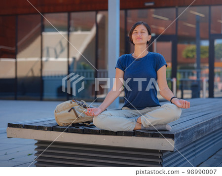 asian female student standing outdoors asian female student standing outdoors 98990007
