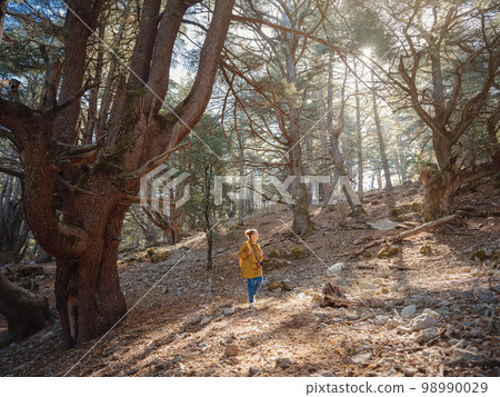 caucasian woman enjoys being in nature, caucasian woman enjoys being in nature, 98990029