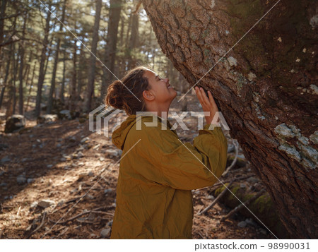 caucasian woman enjoys being in nature, caucasian woman enjoys being in nature, 98990031