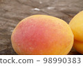 Apricots on a wooden board 98990383