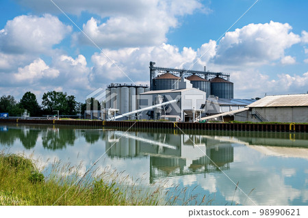 Agro-processing facility for processing, drying, cleaning and storing agricultural products, flour, cereals and grain. Barn elevator on the bank of the canal. Agro-processing facility for processing, drying, cleaning and storing agricultural products, flour, cereals and grain. Barn elevator on the bank of the canal. 98990621