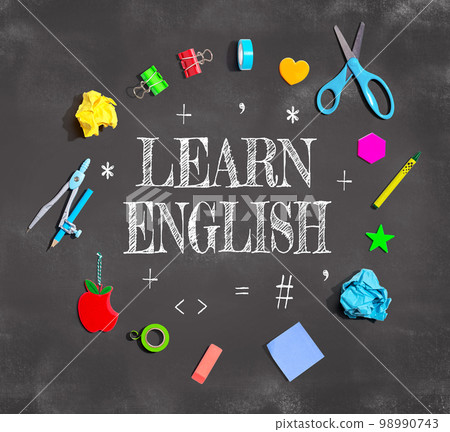 Learn English theme with school supplies on a chalkboard Learn English theme with school supplies on a chalkboard 98990743