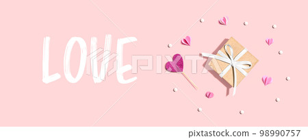 Love message with a small gift box and hearts 98990757