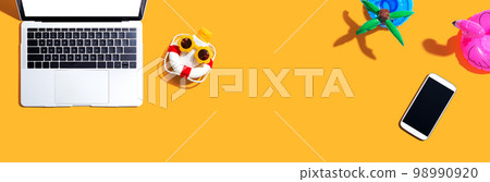 Laptop computer with summer theme items 98990920