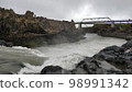 Wild river flowing under bridge downstream of Godafoss waterfalls near Akureyri, Iceland 98991342