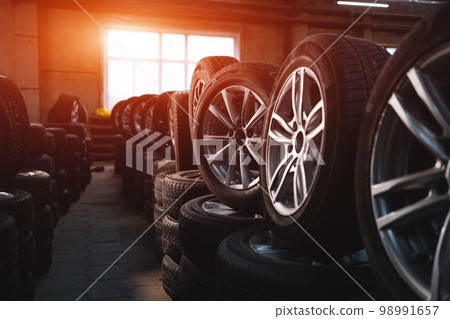 modern warehouse with stack of car tires 98991657