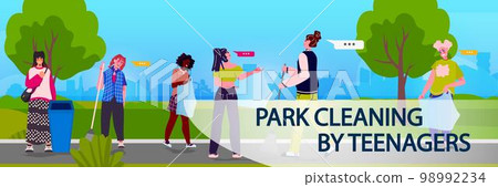 young people collecting trash into bags clean up garbage ecological challenge park cleaning by teenagers concept 98992234