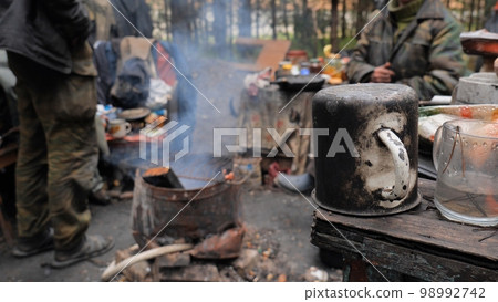 Beggars huts of homeless people near the landfill. Beggars huts of homeless people near the landfill. 98992742