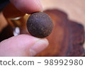 Acupuncture ring pinched with fingers 98992980